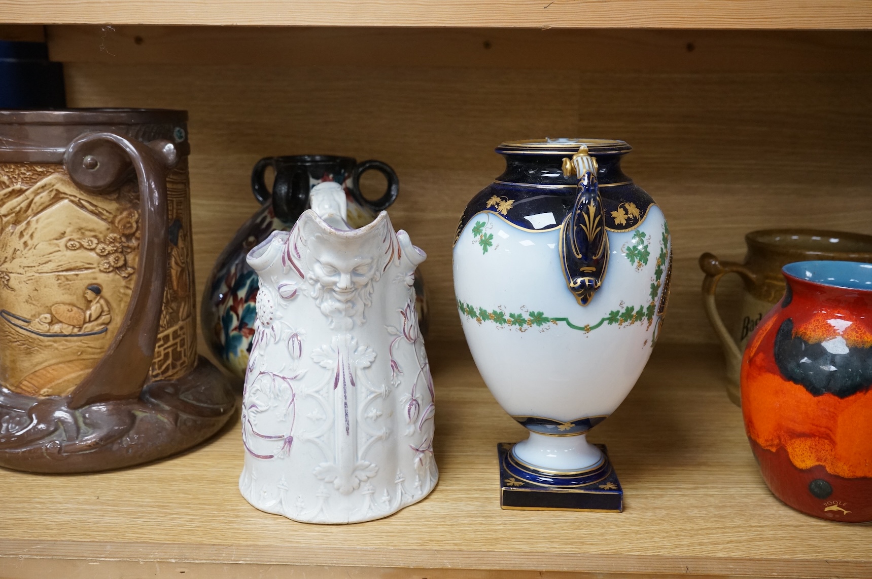 A collection of seven various ceramic vessels including Bretby, Poole, Worcester, continental art pottery etc. 26cm